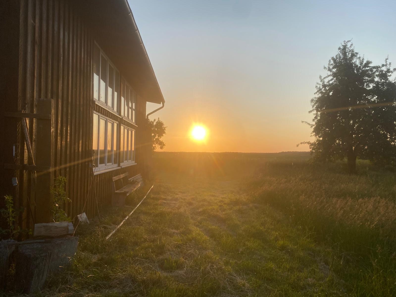 Sundown behind the craftmanshouse of Parsonage of Dewitz